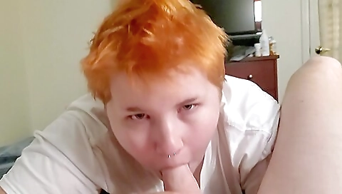 Redheaded with tattooed lips and ass in a pov porn video