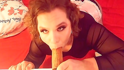 Sexy brunette in stockings and tights gives an erotic blowjob
