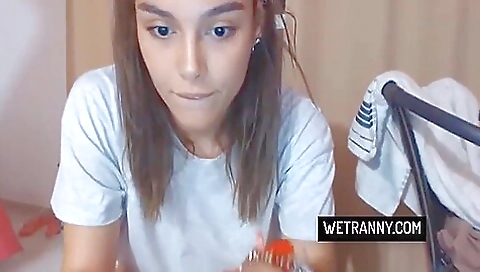 Busty brunette with tattooed legs shows off on camera