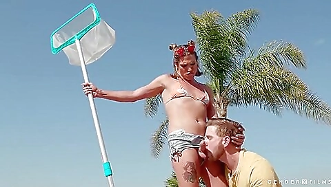 Blonde with a tattooed pussy fucks in the public pool